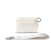A cream-colored leather wallet with a zippered compartment and an ID window attached to a white strap.