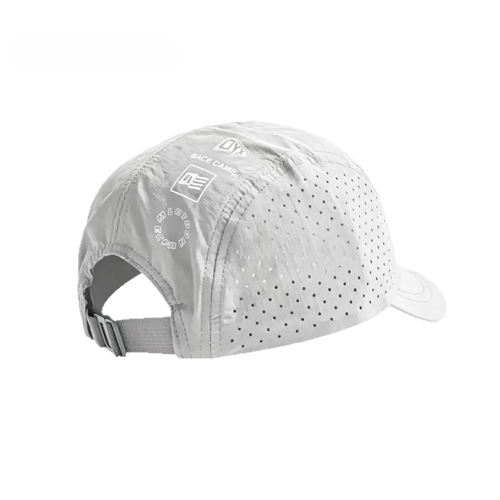 A white mesh baseball cap with a black logo and adjustable strap is shown from the front.