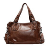 A brown vintage style leather tote bag with a crossbody strap.