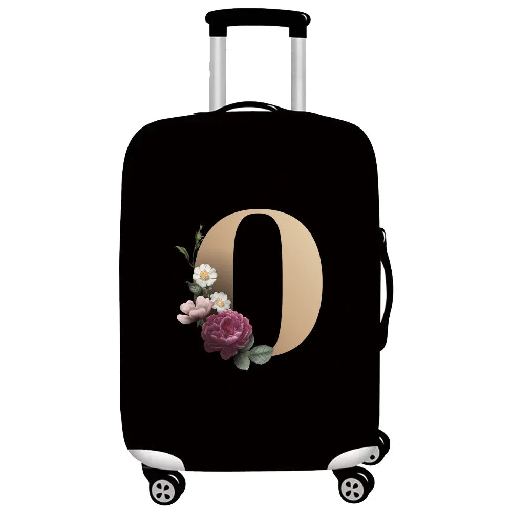 Black luggage with a beige letter O design and floral embroidery
