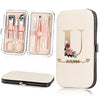 A beige cosmetic case containing a 7-piece stainless steel nail clipper set and a large matching cosmetic pouch.