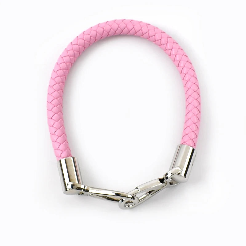 A pink PU leather replacement bag strap with silver metal buckles.