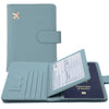 A light blue slim PU leather RFID blocking passport and ID wallet with a flap and embossed airplane design.
