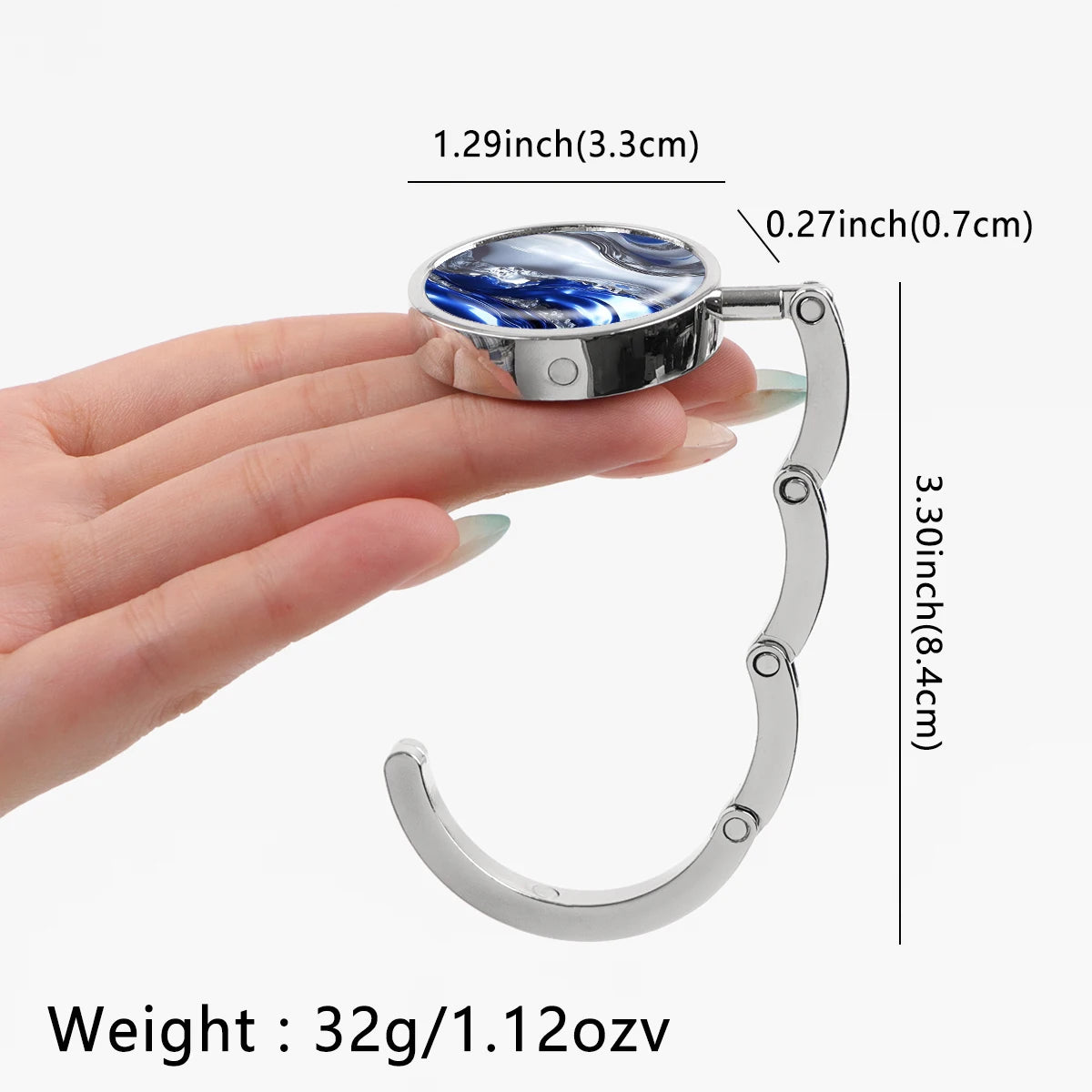 Silver folding table bag hook with a round marble-patterned surface and a curved metal handle