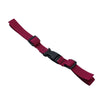 A maroon adjustable tactical backpack chest strap harness.