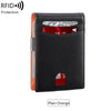 A black minimalist slim wallet with an orange accent, showing a card slot and a visible RFID protection feature.