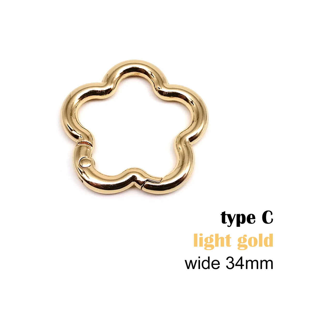 Pince de forme fleur d'oie, type C, large 34mm, couleur or clair.