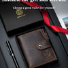 A brown genuine leather men's business wallet with a red ribbon, shown open in a black presentation box.