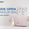 A pink padded makeup bag with a wide open design sitting on a white surface.