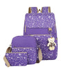 Purple durable canvas student backpack with a bear charm and gold accents