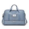 A light blue durable nylon travel duffle bag with gray handles and a quilted texture.