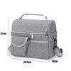 A gray reusable insulated lunch bag with a zippered compartment and strap, shown from the top view.