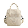 Bolsa reutilizable aislante beige con tapa acolchada y compartimentos con cremallera.