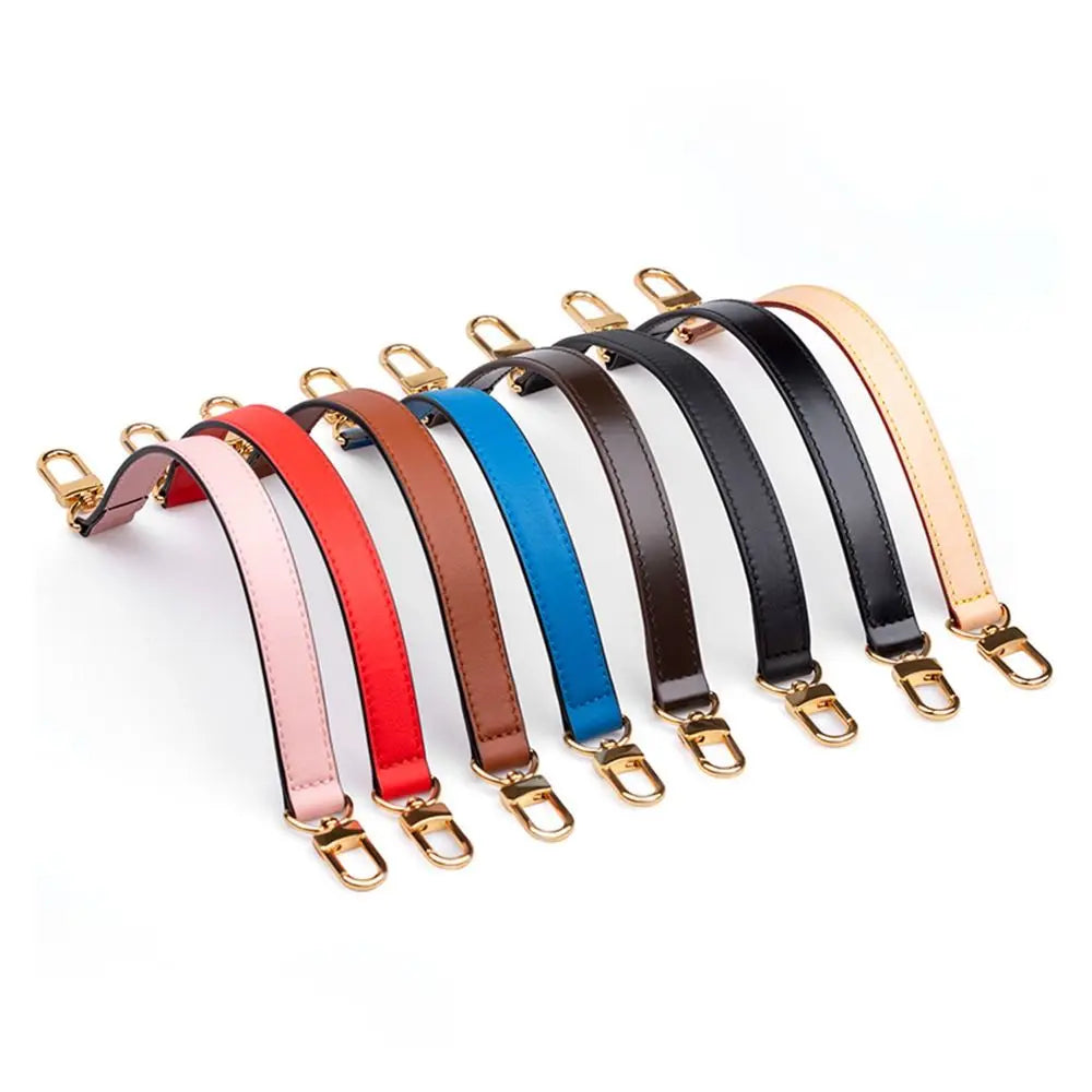 A collection of genuine leather replacement shoulder straps in various colors including pink, red, brown, blue, and black.