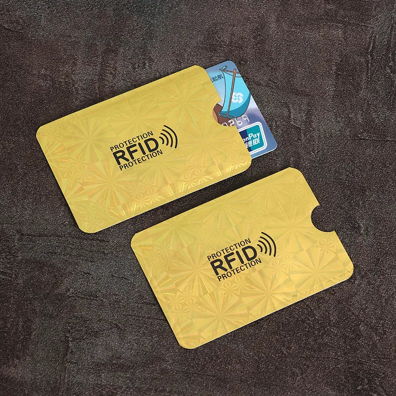 Yellow RFID protection card sleeves with a wireless signal icon and a blue card nearby.