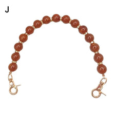 Handcrafted resin stone bead bag chain with round amber beads and gold clasps