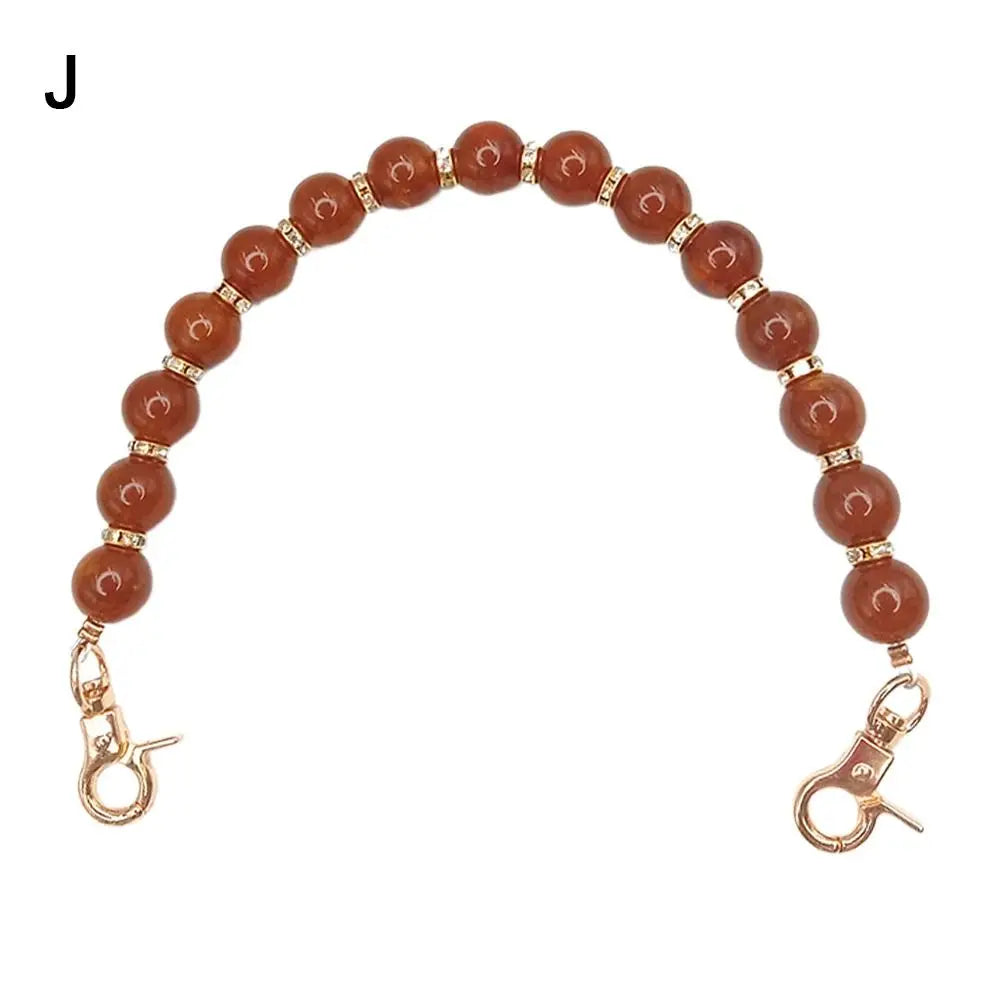 Handcrafted resin stone bead bag chain with round amber beads and gold clasps