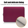 A close-up view of a maroon laptop sleeve showing the soft and delicate lining material.