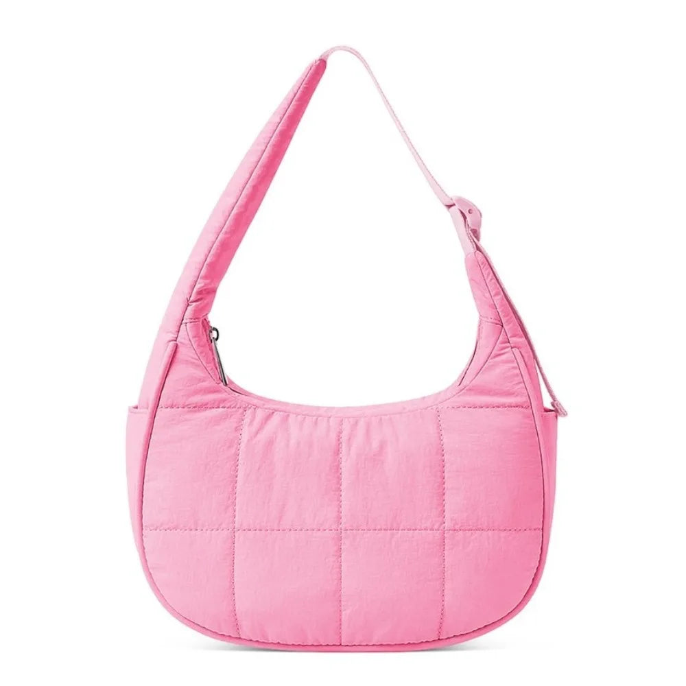 A pink quilted nylon shoulder bag with an adjustable strap.