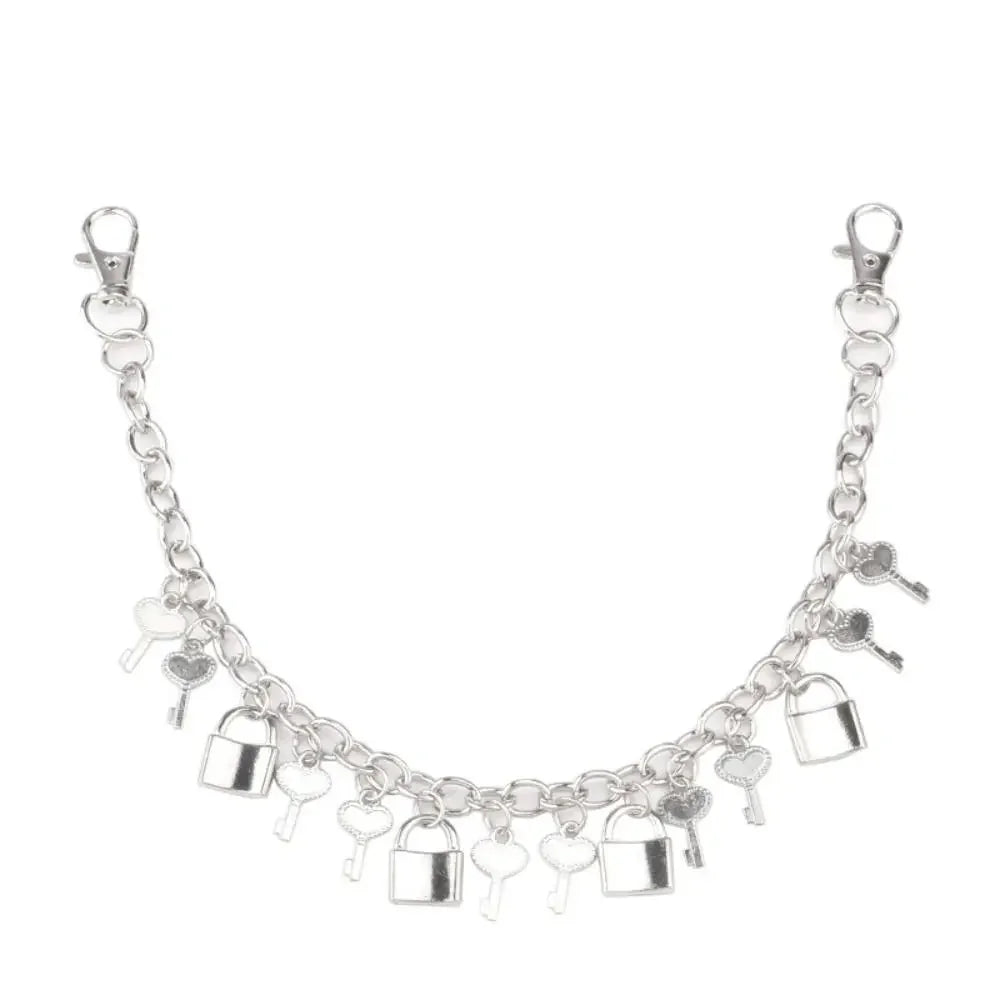 Silver metal purse chain strap for crossbody bags with a decorative link pattern