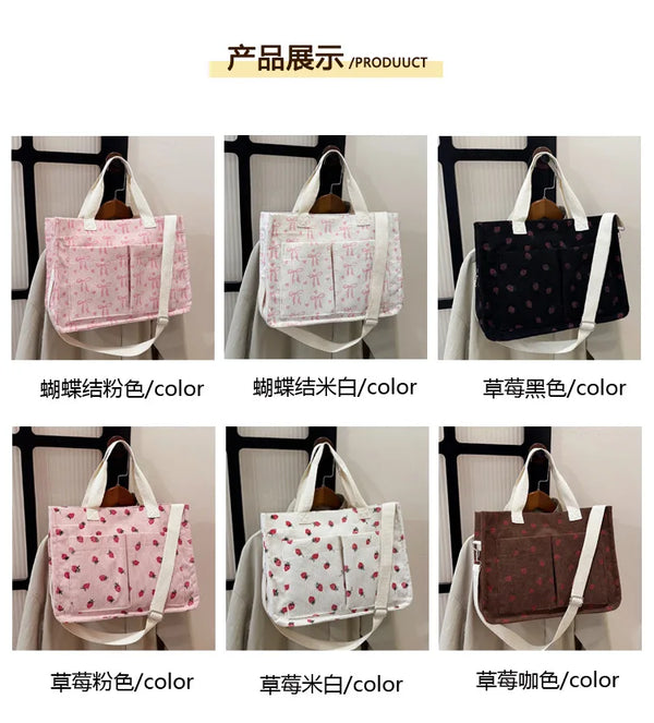 A set of canvas tote bags featuring various colors including pink, white, and black with strawberry designs.