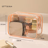 A clear plastic toiletry bag with an orange rim and a zipper, showing various cosmetic items inside.