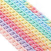 A close-up of multiple strands of colorful acrylic link chains in a rainbow gradient.