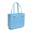A light blue portable EVA beach tote bag with handles and small holes on the body.