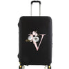 Black luggage with a pink floral letter V design and silver handle.