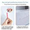 Hands apply positioning stickers to a bathtub cover edge to prevent slipping during bathing