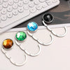 A set of round acrylic foldable hooks in various colors including black, blue, and green, displayed on a white background.