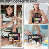 A woman holds a clear cosmetic bag with a black strap and colorful chenille letters against a white background.