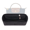 A black felt organizer insert for handbags with a silver clasp.