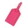 A pink PU leather luggage tag with a silver clip attached to a pink strap.