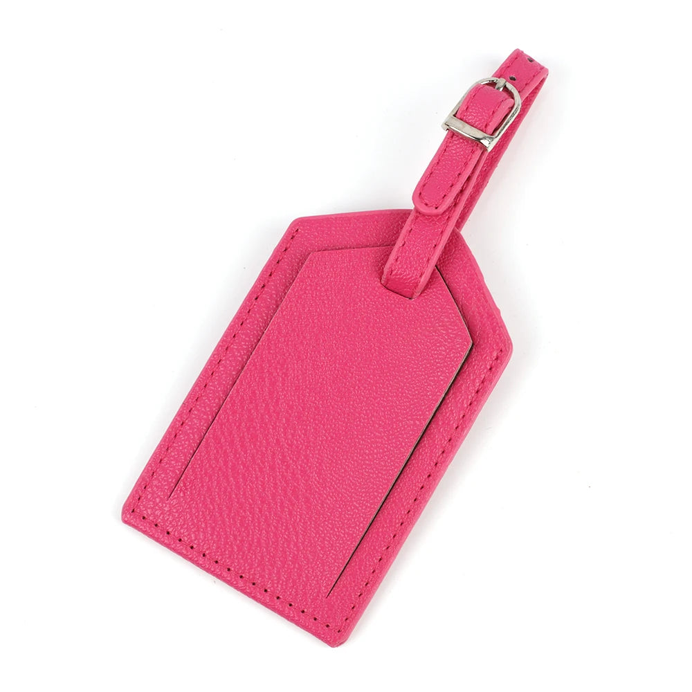 A pink PU leather luggage tag with a silver clip attached to a pink strap.