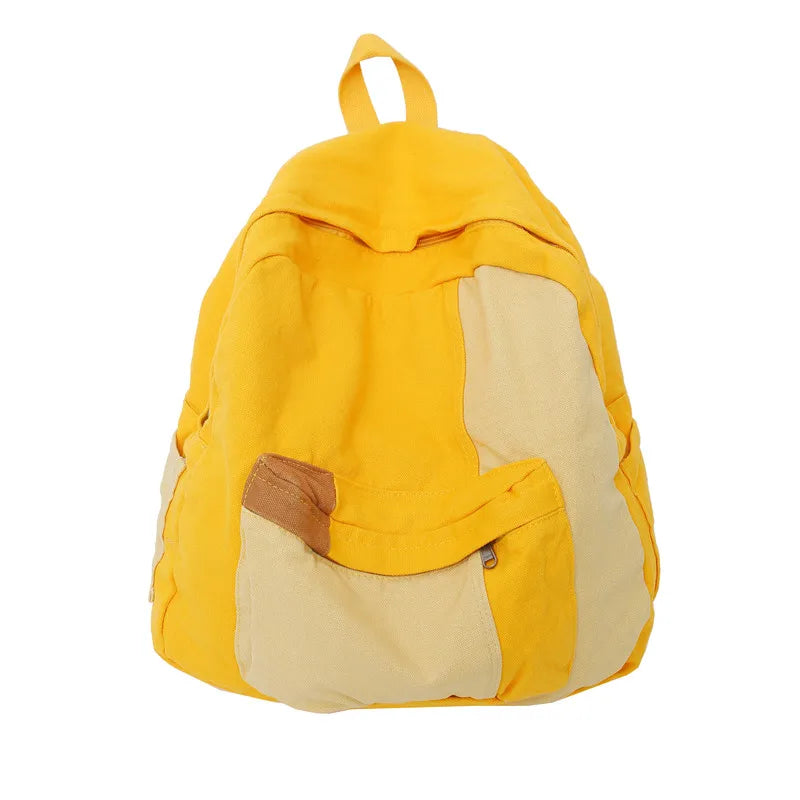 A yellow canvas fashion backpack with tan accents, shown from the back.