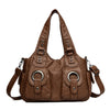 Braune Vintage Soft Kunstleder-Schultertasche mit mehreren Riemen und Hardware.