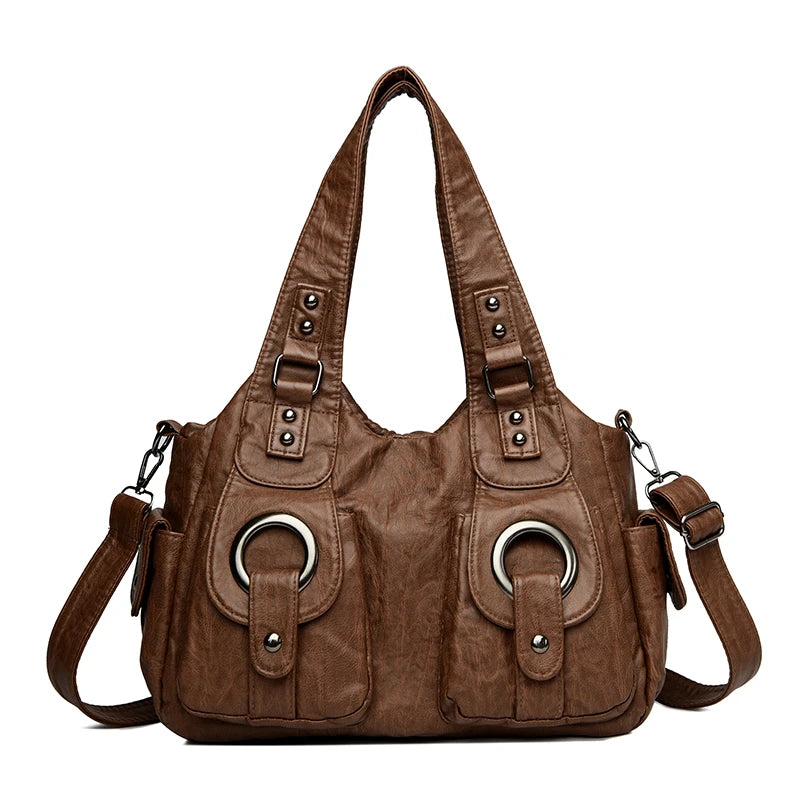 Braune Vintage Soft Kunstleder-Schultertasche mit mehreren Riemen und Hardware.