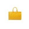 A bright yellow faux crocodile leather tote bag with crystal accents.