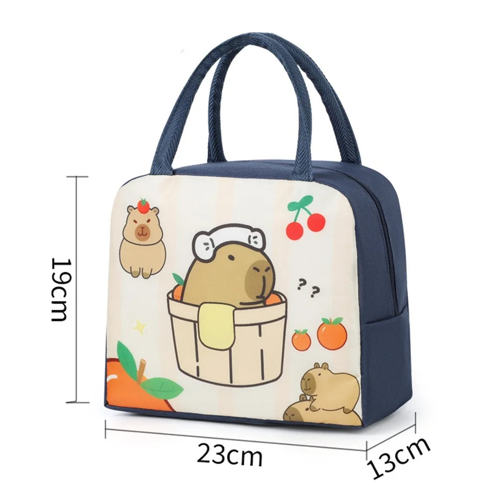 A navy blue insulated lunch bag featuring a cartoon capybara design with an orange carrot.