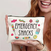 A beige pouch filled with colorful emergency snacks, held by a person.