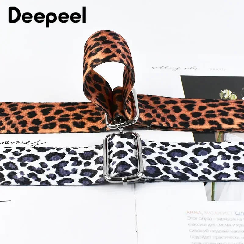 A close-up of a leopard print adjustable strap for bags shown in brown and black patterns.