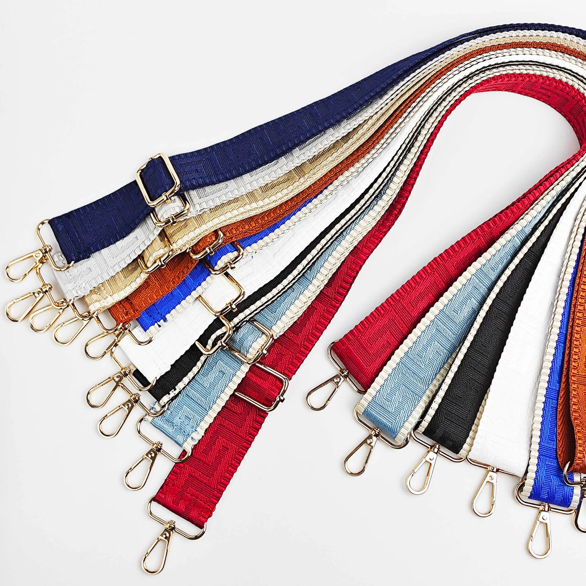 A collection of adjustable wide crossbody bag straps in various colors including blue, white, red, and black.