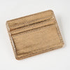 A gold-colored slim leather mini wallet card holder with stitched edges.