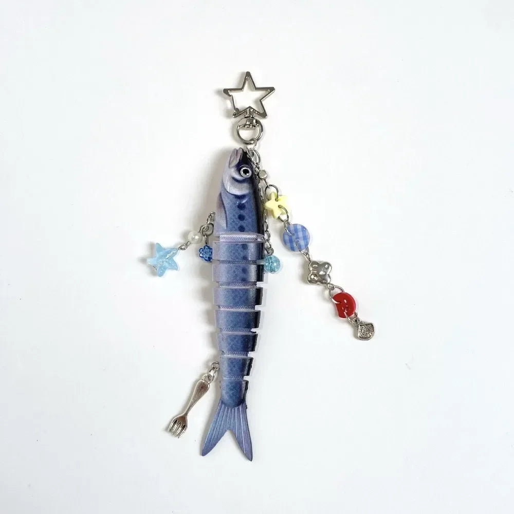 A small, realistic simulation fish keychain with a silver charm and colorful accents.