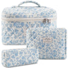A set of quilted cotton makeup organizers in light blue and white floral patterns.