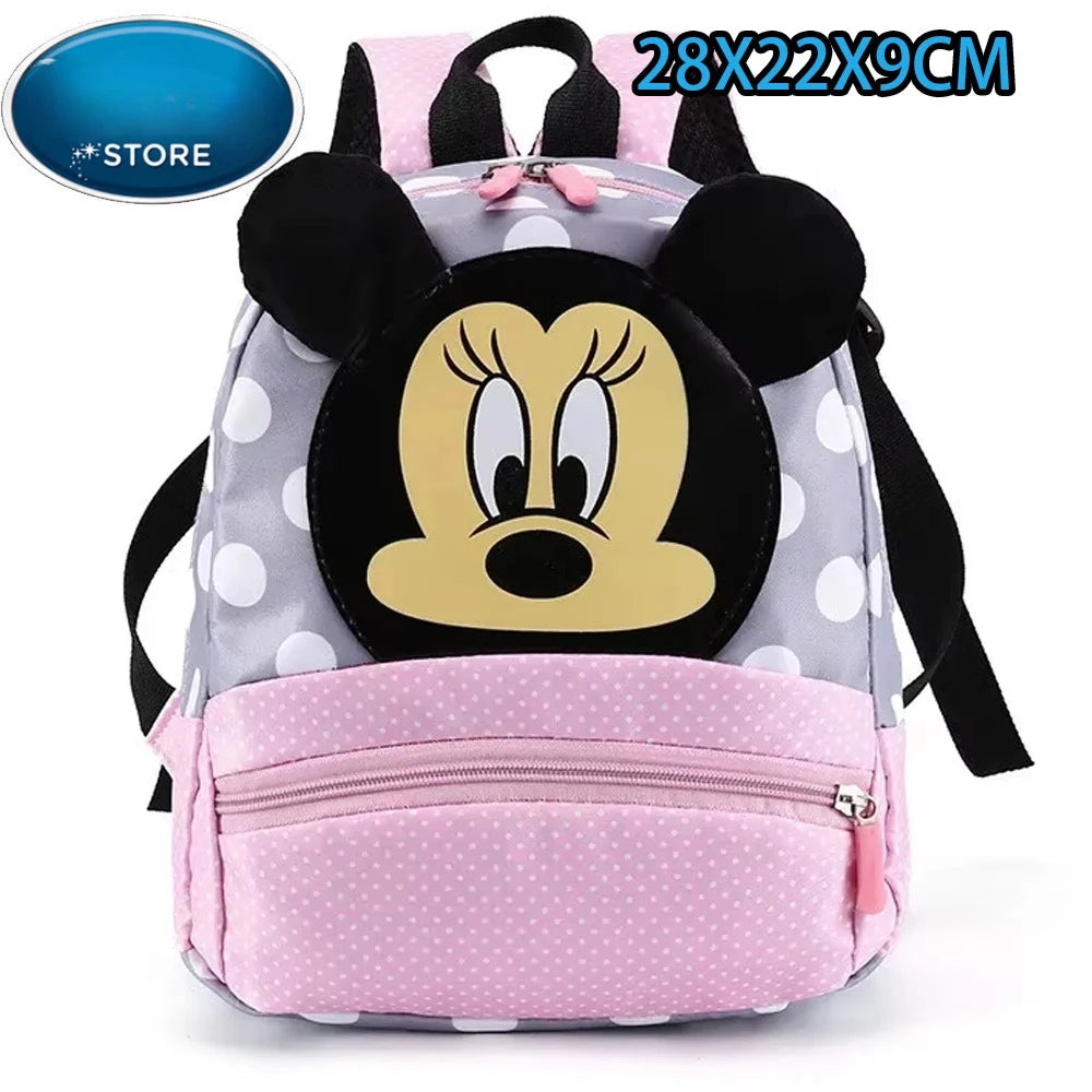 Mochila de peluche con ratón pato rosa y gris, orejas de Minnie y bolsillo con cremallera rosa.
