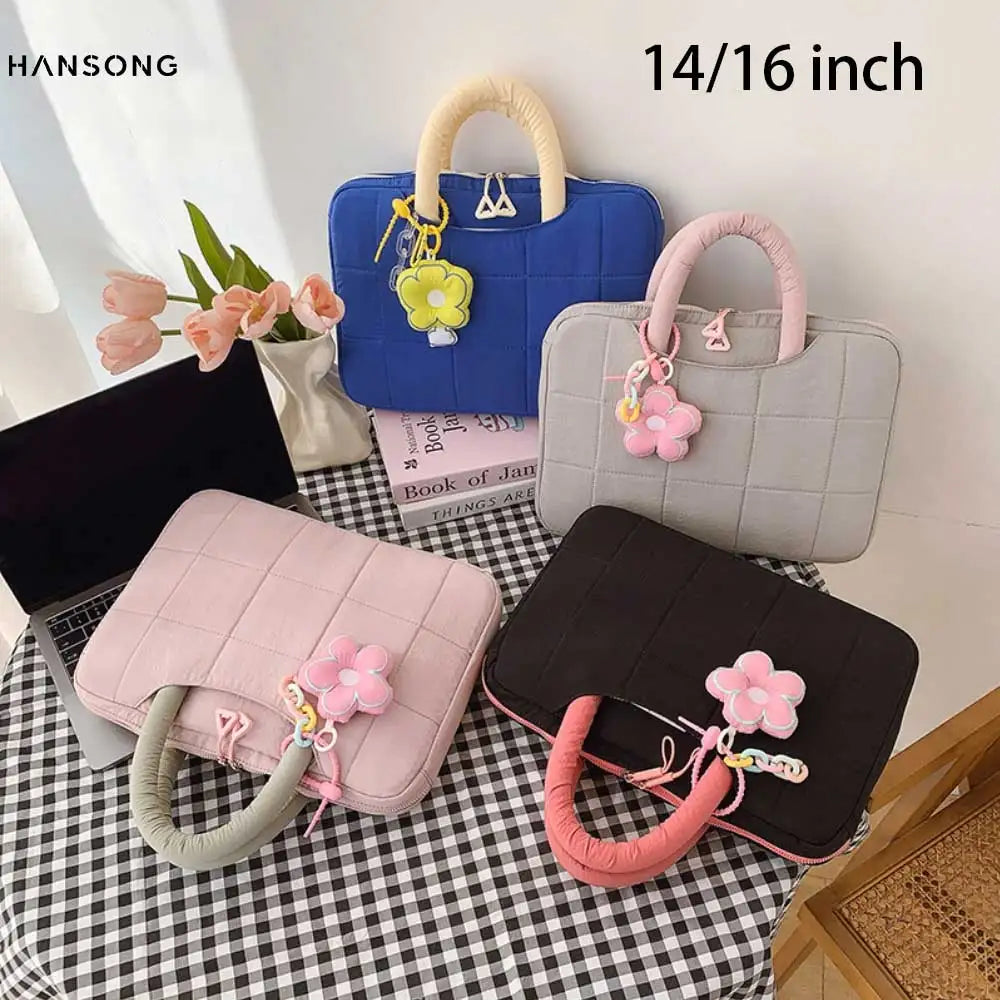 A collection of quilted laptop sleeves in blue, gray, and pink featuring floral accents.