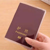 A hand holds a dark purple card sleeve with gold text reading passport.