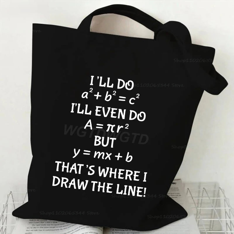 A black canvas tote bag featuring mathematical equations and text on the front.